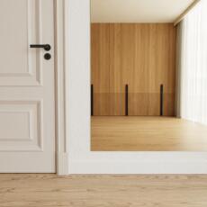 Brons gekleurde dansspiegel tegen de muur in ruime kamer