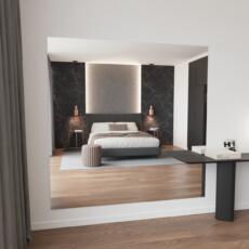 Moderne verzilverde blanke spiegel aan de muur in lichte ruimte