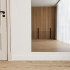 Grijs gekleurde pilatesspiegel aan de muur in studio of woonruimte