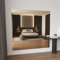 Brons gekleurde slaapkamerspiegel aan de muur in warm interieur