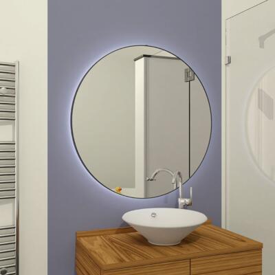 Ronde spiegel met spiegelverlichting in een badkamer